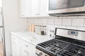 Lowe S Stock Cabinets Review Diamond Now Arcadia White Shaker Cabinets Elizabeth Burns Design Raleigh In 2020 White Shaker Cabinets Shaker Cabinets Stock Cabinets