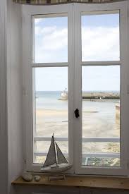 La Maison Sur Le Quai Is Located On The Seafront In Port En Bessin Normandie Seaside Living Cottages By The Sea Seaside Cottage
