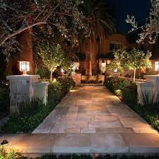 An Intricate Stone Walkway Light Up Beautiful With Simple Outdoor Lights Contemporary Landscape Design Contemporary Landscape Backyard Walkway