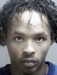 Woman arrested; son still sought in shooting