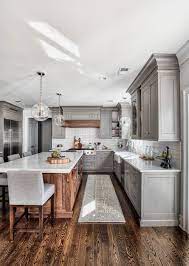 Although you can opt for a white countertop that perfectly matches your cabinets, light gray countertops will offer just a little bit of separation. Kitchen With Gray Cabinets Why To Choose This Trend Decoholic