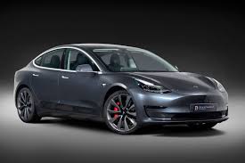The main changes to the model 3 include a selection of new wheel designs, black exterior detailing, improved interior quality (more on that later), an electric tailgate, more efficient tyres and better efficiency in cold weather. Tesla Model 3 Grey Black Background Pearce Dale