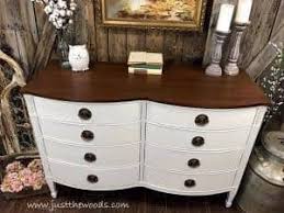 We repurposed the top of this china hutch and turned into a modern farmhouse looking cabinet simply by adding feet and painting it green! How To Get Farmhouse White Painted Furniture By Just The Woods