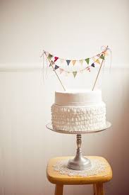 This Is Such A Charming Little Cake The Ruffles Contribute To The Simplistic Look And Account For What I Am Sure Is Ho Cake Bunting Wedding Cakes Cake Toppers