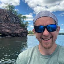 What creature can capture and drag an adult houndfish into the sand?