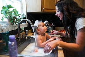 Read full answer here.likewise, people ask, can i bathe my baby in the kitchen sink? Baby Bath Bubble Stock Photos Offset