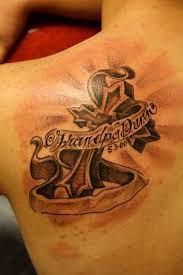 Which is the best tattoo design for a cross? Holy Cross And Banner Tattoo Design For Men Back Segerios Com