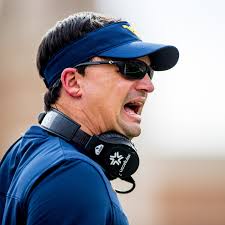 Head football coach Neal Brown inks contract extension with WVU