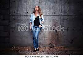 Up against can mean to be firmly pressed against something. Woman Leaning Against Wall Attractive Young Woman In Casual Clothes Leaning Against Old Wall Canstock