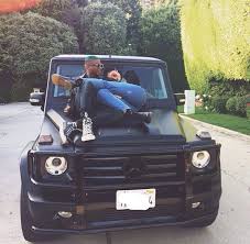 Kylie Jenner Cuddles Shamari Berkley On The Hood Of Her Mercedes Wagon Kylie Jenner Car Kylie Jenner G Wagon