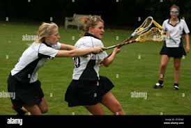 Heathfield St Marys School Ascot.... Lara Macpherson(L), Lilly Brookes and  Charlotte Bird in background, during Lacross practice pic David Sandison  12102007 Stock Photo - Alamy
