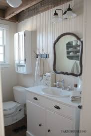 This cottage bathroom design by bella mancini uses beadboard as the bottom white half, installed against the black wall color. Beadboard Bathroom Ideas Luxury Excellent Bathroom With Beadboard Layjao