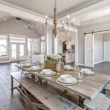 It offers a cozy dining set with mismatched chairs sitting on a blue patterned rug. The Gray Barn Distressed White Wood 6 Light Chandelier For Dining Room On Sale Overstock 28338444