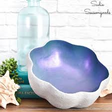 This polystone and capiz long bowl will add a hint of relaxation and peace when displayed on tables and shelves in your coastal style home. Clam Shell Bowl With Baking Soda Paint For Modern Coastal Decor