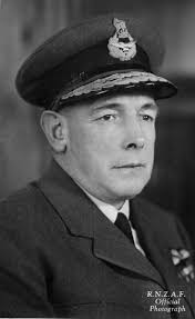 Portrait of Sir Leonard Monk Isitt, sitting at desk, writing in book