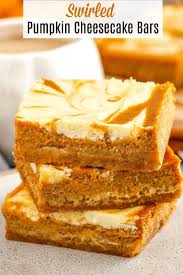 These Amazing Swirled Pumpkin Cheesecake Bars Have A Buttery Graham Cracker Crust Spiced Pum Pumpkin Cheesecake Bars Cheesecake Bar Recipes Pumpkin Cheesecake