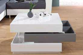 Kostenlose lieferung an den aufstellort sowie links 20800890 couchtisch weiß hochglanz wohnzimmertisch wohnzimmer tisch mit stauraum drehbar online kaufen bei woonio. Couchtisch Weiss Grau Hochglanz 70 90cm Drehbar Dunord Design