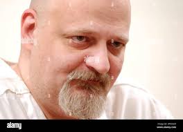 John Glenn Roe, a death row inmate at the Mansfield Correctional  Institution in Mansfield, Ohio, listens during an interview Wednesday, Jan.  21, 2004. Roe is scheduled to be executed Feb. 3 for