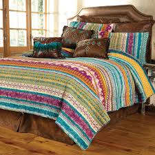 This unique collection features a mixture of medallions and tribal geometrics in stripes of yellow and green with pops of navy. Fuchsia Tribal 3 Piece Quilt Set Full Queen