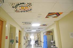 The Pediatric Unit Of Signature Healthcare Brockton Hospital With Decorated Ceiling Tiles And Colorful Art On The W Hospitales Infantiles Hospitales Infantiles