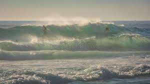 This delicate pastel shade will bring serenity to rooms in your home and subtle charm to any outfit. Surfers Ride A Big Wave In Windy Conditions Stock Image Image Of Water Ride 101092447