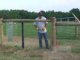 We did one 100' section with red brand kennel and garden fence. Horse Fence Installation Part 2 Of 2 Youtube Horse Fencing Fence Fence Construction
