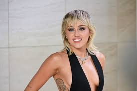 The short hairs at the crown are sweep towards the front grazing the forehead. Miley Cyrus Makes The 1980s Trendy Again With Sky High Fauxhawk Hairstyle See Photos Allure