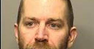 Man accused of strangling, pointing gun at family member