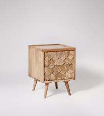 The mango wood used on this product is sustainably sourced from trees that no longer produce fruit. Terning Bedside Table Mid Century Style In Natural Mango Wood Swoon