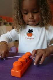 Teaching How To Floss With Mega Blocks Yarn And Playdoh Dental Health Month Activities Dental Health Dental Kids