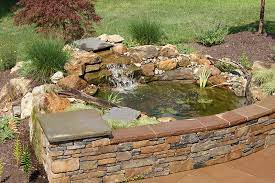 The bathtub creates its own liner for a pond, which simplifies the installation. We Could Turn The Old Hot Tub Area Into A Pond Fountain Hot Tub Backyard Diy Water Feature Ponds Backyard
