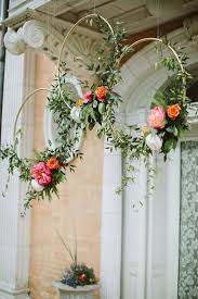 Diy wildflowers in glass vases photo. Gold Hoops With Flowers Seriously How Stylish Can A Wedding Get Photo Paige Jones Photography Wedding Decorations Wedding Flowers Diy Wedding