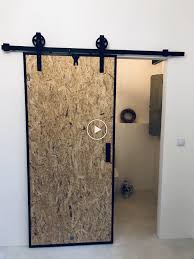 Hall With Sliding Doors Osb Barn Doors In White Wall Rustical And Modern Portes De Grange Interieur Portes Coulissantes Modernes Porte Coulissante