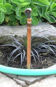 Blog Omotives A Simple Garden Hose Guide And Plant Protector Garden Hose Plants Garden