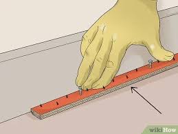 Do not lay the padding over the tackless strips. Simple Ways To Fit Carpet Grippers With Pictures Wikihow