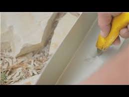 You'll need drop outlets to connect the gutters to the downspouts. Gutter Maintenance How To Move The Downspout On A Gutter Youtube