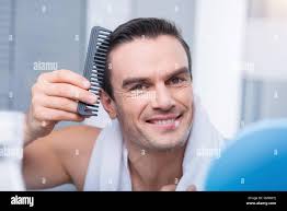 Gay smart man making hair style Stock Photo