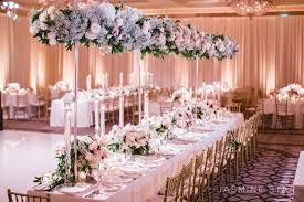 If a rainbow centerpiece feels like too much and a monochromatic centerpiece pick one color, and then do lots of variations of it (think pink, red, and super light blush). Extravagant Wedding Floral Centerpieces Modwedding
