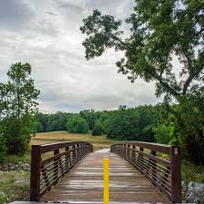 Olathe's Cedar Niles Park offers a 4-mile out-and-back that can begin at  one of three trailheads. The trail winds through rolling hills, forest and  prairie. There are also multiple bridged creek crossings.