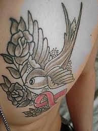 There are many reasons for wearing these tattoos and here is a look at some of the common meanings of the ribbon. Breast Cancer Bird Tattoos Tattoo Ideas For Men For Girls