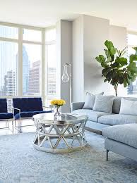 Those exquisite end tables boast of cubic design with open front, and a gray finish adorned with silver accents, composing a contrasting mosaic. Blue And Gray Living Room Design Contemporary Living Room