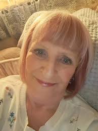 Pink and blonde although the pink doesn't show up well in this light , love  the cut . I'm 74 .