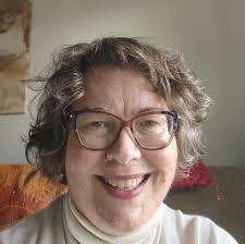 What is the name of the talk show host in Michelle's video from Maggie's?