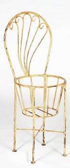 Wrought Iron Chair That Holds Flower Pot Holder Plant Stand Iron Chair Wrought Iron Chairs Swivel Rocker Recliner Chair