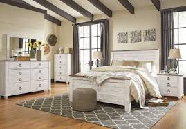 Curved silhouette headboard and footboard with paneling and matching side rails are made from replicated woodgrain in a stunning whitewash finish. Willowton 4 Piece Panel Bedroom Set