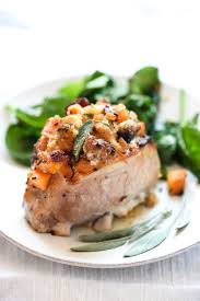It looks so pretty garnished with slices of apples and oranges and fresh herbs. Easy Baked Stuffed Pork Chops Recipe Foodiecrush Com