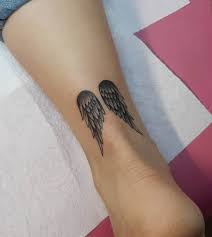 Small colorful baby angel tattoo on arm. Top 91 Best Angel Wings Tattoo Ideas 2021 Inspiration Guide