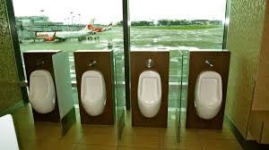 Changi Airport Toilets Offer Passengers A View Of The Runway Bathroom Urinals Concrete Wall