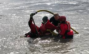 woman rescued from mud as tide rushed in