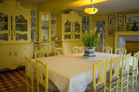 The blue plates in the cabinets provide an interesting pop against the yellow. Monet S Gardens Giverny A Day Trip From Paris The Whole World Is A Playground